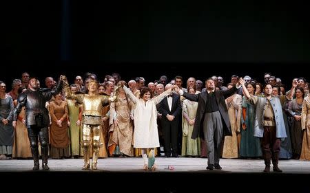 Russian soprano Anna Netrebko (C) and the cast acknowledges the applause at the end of the Verdi's Joan of Arc, opening of the 2015-16 opera season at Milan's La Scala opera house, December 7, 2015. REUTERS/Alessandro Garofalo