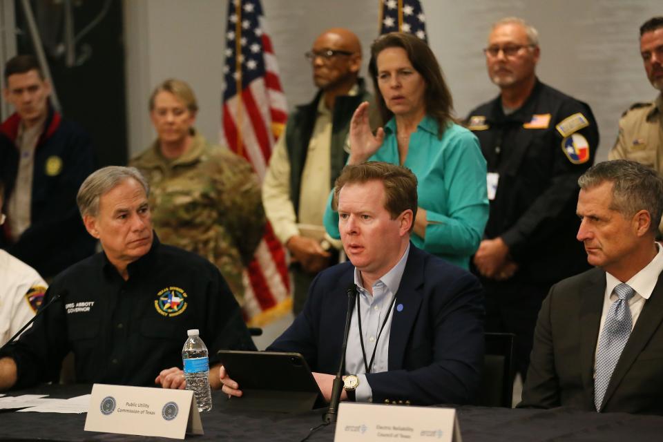 Peter Lake, Chairman of the Public Utility Commission of Texas, center, during a press conference with Gov. Greg Abbott and representatives from the Texas Division of Emergency Management, ERCOT, in February, 2022.