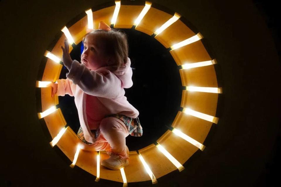 One-year-old Mary Tatum Pearson explores decorations at the Second Annual Christmas Tree Lighting in Belzoni, on Dec. 5, 2023.