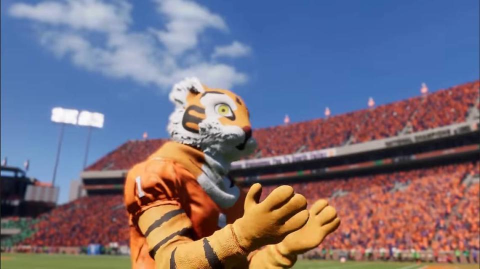 The Tiger, Clemson football’s mascot, is seen at Memorial Stadium in an EA Sports College Football 25 screenshot. One other fun detail here: The small “wedge” of green in the bottom left corner, which accurately denotes the seating area next to the visitors’ locker room in the west end zone where visiting ACC teams (and most non-conference teams) receive a ticket allotment from Clemson.