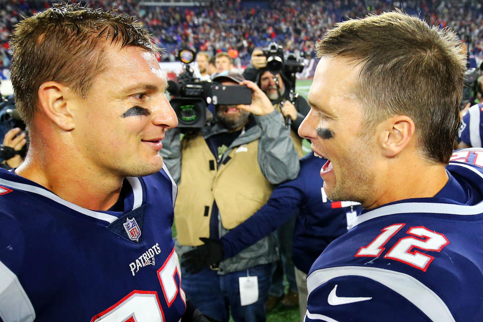 FOXBOROUGH, MA - OCTOBER 14:  Tom Brady #12 talks to Rob Gronkowski #87 of the New England Patriots after a victory over the Kansas City Chiefs at Gillette Stadium on October 14, 2018 in Foxborough, Massachusetts.  (Photo by Adam Glanzman/Getty Images)