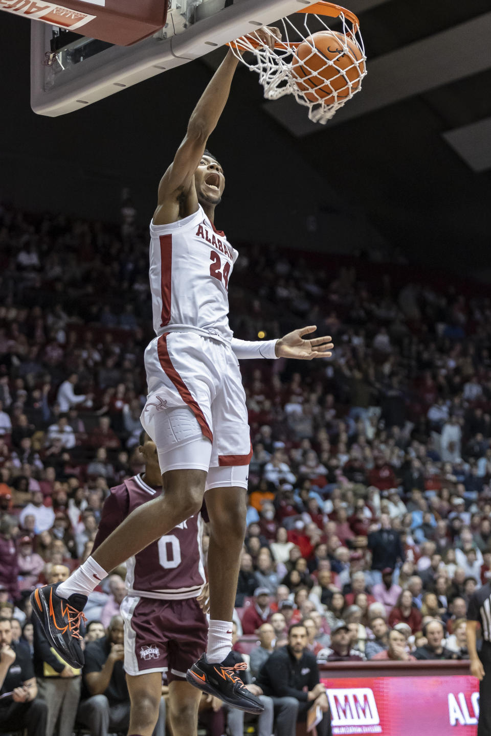 Alabama forward Brandon Miller (24) dunks on Mississippi State during the first half of an NCAA college basketball game, Wednesday, Jan. 25, 2023, in Tuscaloosa, Ala. (AP Photo/Vasha Hunt)