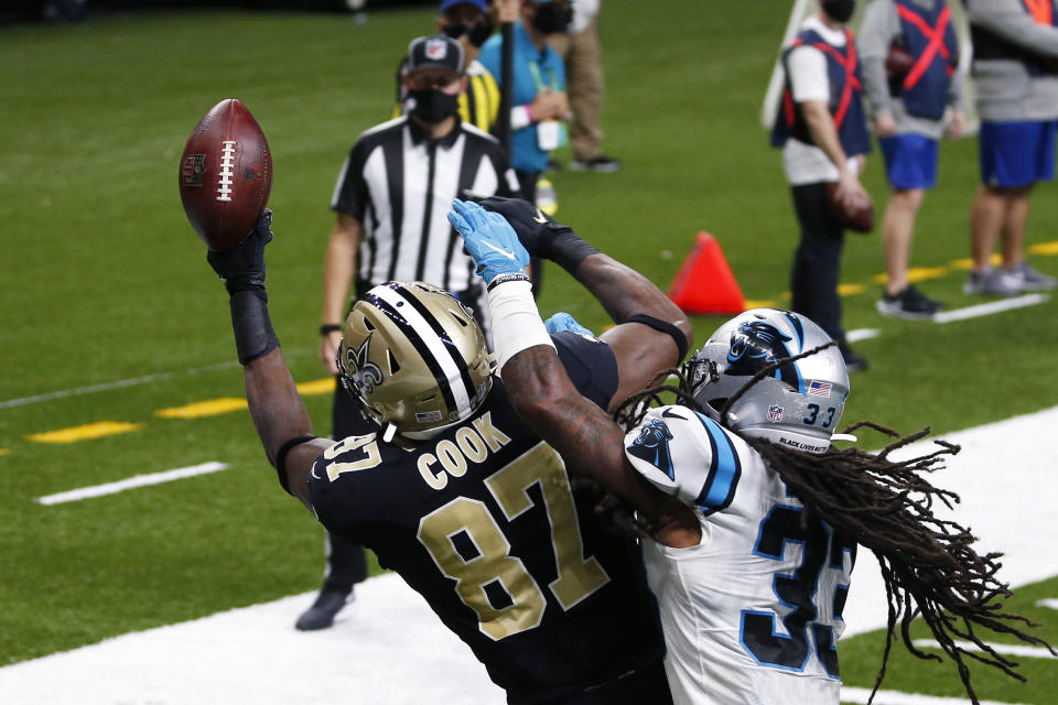 New Orleans Saints tight end Jared Cook (87) pulls in a touchdown reception ain't Carolina Panthers free safety Tre Boston (33) in the first half of an NFL football game in New Orleans, Sunday, Oct. 25, 2020. (AP Photo/Butch Dill)