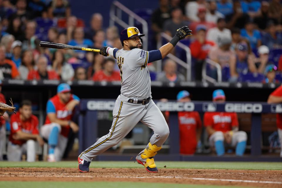 The Brewers' Carlos Santana hits a three-run home agaisnt the Marlins run during the sixth inning Saturday, the 300th of his career.