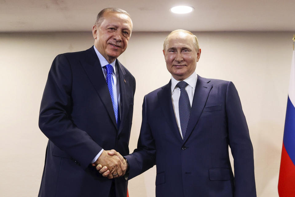 FILE - In this photo provided by the Turkish Presidency, Turkish President Recep Tayyip Erdogan, left, shakes hands with Russian President Vladimir Putin during their meeting, in Tehran, Iran, July 19, 2022. Turkish President Recep Tayyip Erdogan will meet with Vladimir Putin on Monday, Sept, 4, 2023 in a bid to persuade the Russian leader to rejoin the Black Sea grain deal that Moscow broke off from in July. (Turkish Presidency via AP, File)