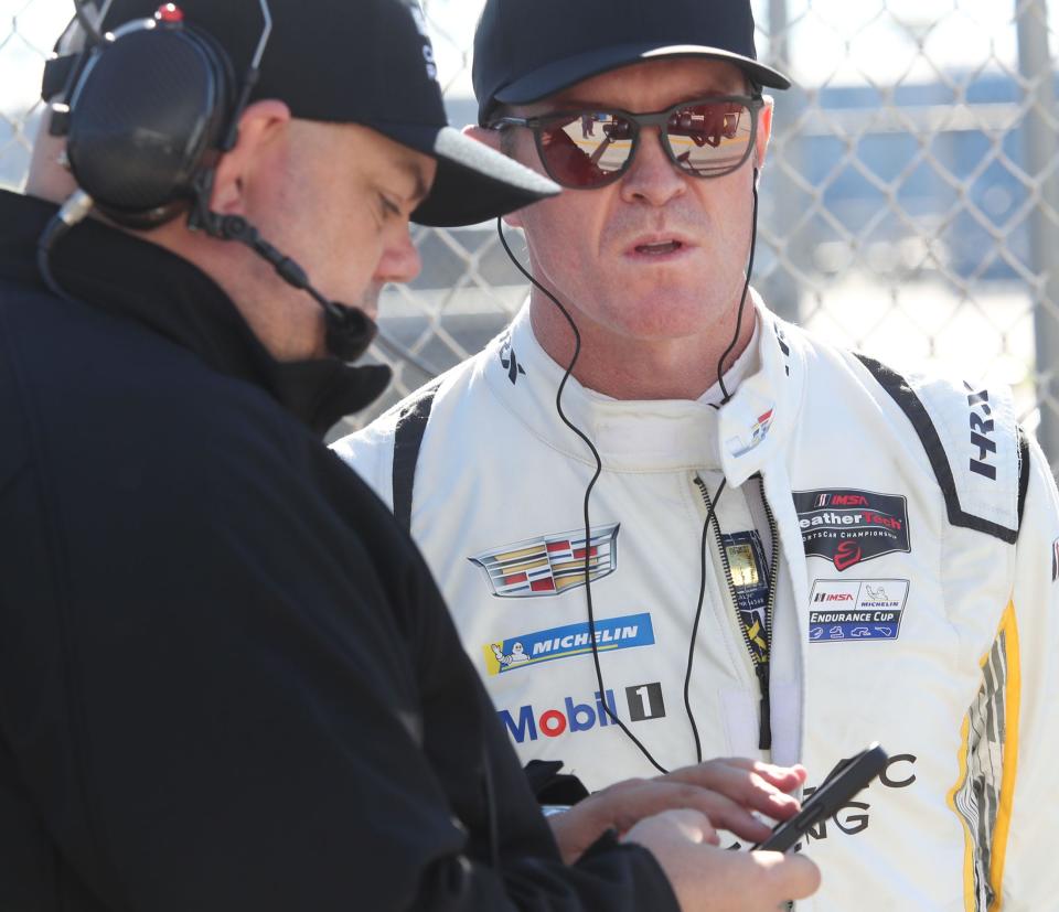 Scott Dixon chats with a crew member at Daytona.