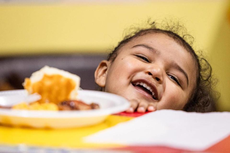 Student Micah Harley, 2, laughs while eating his dinner at the Future Scholars’ Childcare and Transportation child care home in Grand Prairie on Thursday, March 14, 2024. Future Scholars’ is one of a few options in Tarrant County that provide 24/7 child care. Chris Torres/ctorres@star-telegram.com