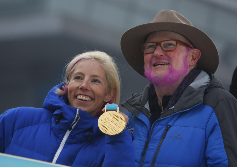 Twelve years ago, U.S. Ski & Snowboard Association official Tom Kelly promised cross-country skier Kikkan Randall that he would dye his beard pink if she ever won an Olympic medal. (AP Photo)