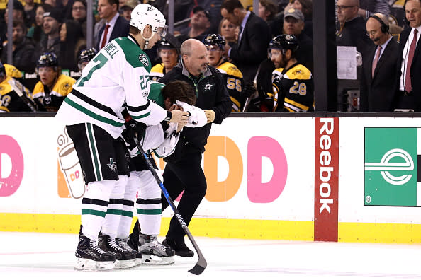 BOSTON, MA - MARCH 30: Adam Cracknell #27 of the Dallas Stars assists his injured teammate Curtis McKenzie #11 during the third period against the Boston Bruins at TD Garden on March 30, 2017 in Boston, Massachusetts. The Bruins defeat the Stars 2-0. (Photo by Maddie Meyer/Getty Images)