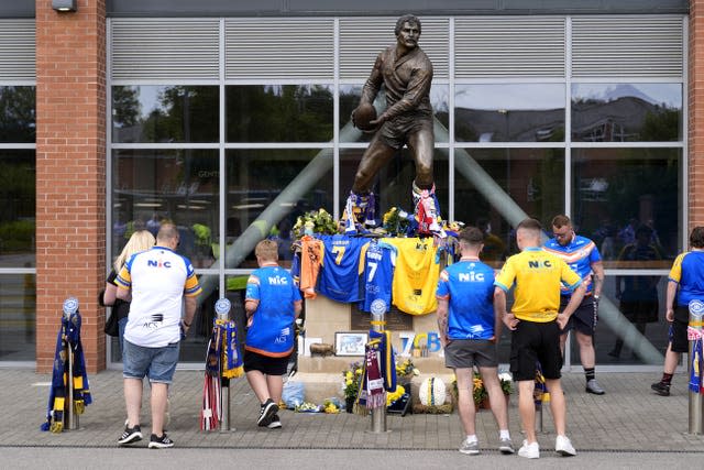 Tributes left outside the stadium (PA)