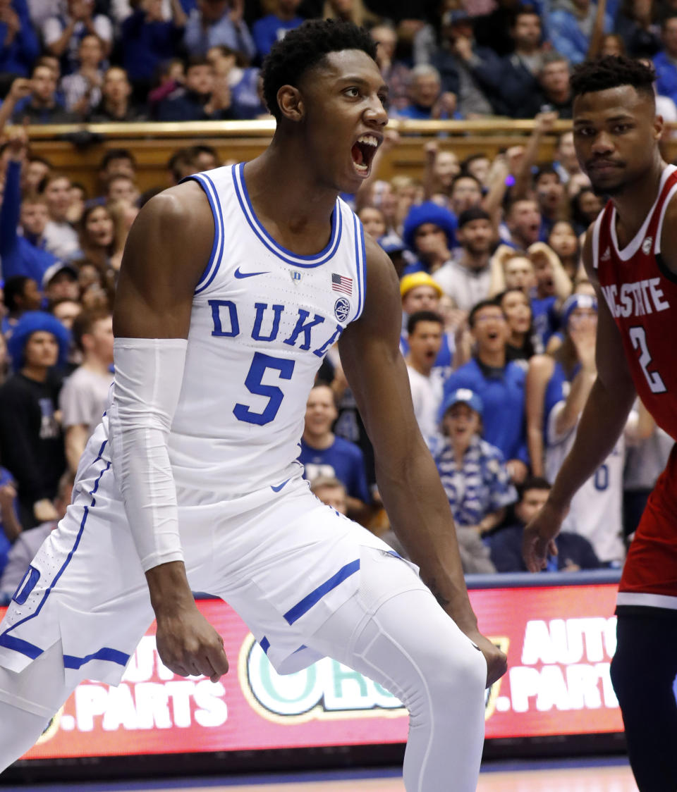 Duke's RJ Barrett (5) celebrates after a score while North Carolina State's Torin Dorn (2) looks on during the second half of an NCAA college basketball game in Durham, N.C., Saturday, Feb. 16, 2019. (AP Photo/Chris Seward)