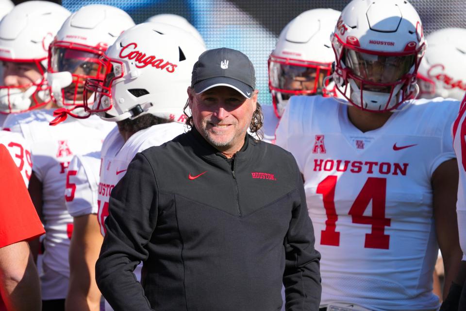 Nov 19, 2022; Greenville, North Carolina, USA;  Houston Cougars head coach Dana Holgorsen gets ready to head out onto the field before the game against the East Carolina Pirates at Dowdy-Ficklen Stadium. Mandatory Credit: James Guillory-USA TODAY Sports