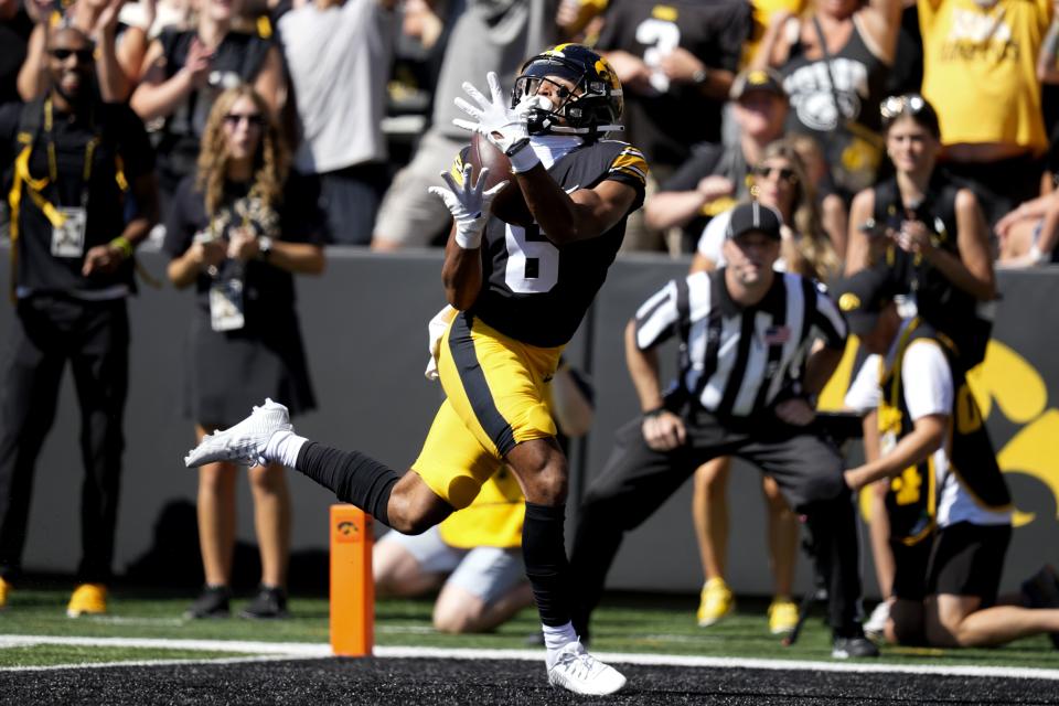 Iowa wide receiver Seth Anderson (6) catches a 36-yard touchdown pass during the first half of an NCAA college football game against Utah State, Saturday, Sept. 2, 2023, in Iowa City, Iowa. (AP Photo/Charlie Neibergall) | AP