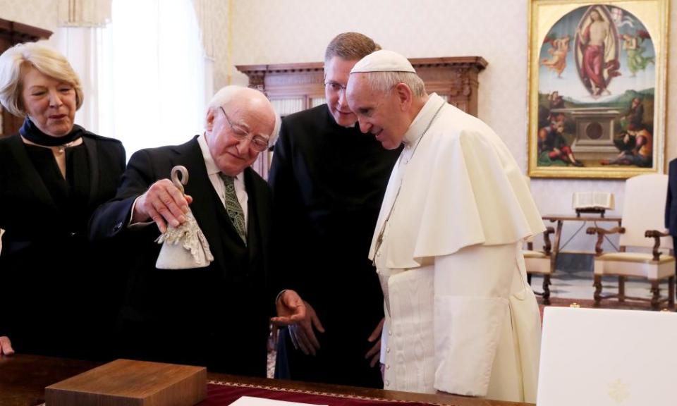 Michael D Higgins and wife Sabina Coyne presents the pope with a ‘climate bell’.