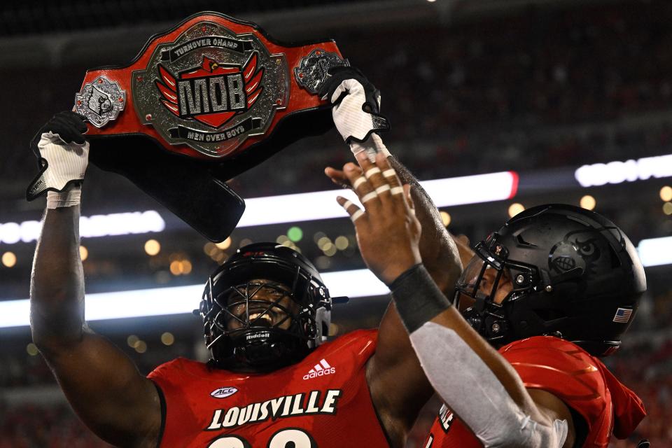 Sep 16, 2022; Louisville, Kentucky, USA; Louisville Cardinals linebacker Yasir Abdullah (22) celebrates after forcing a Florida State Seminoles turnover during the second quarter at Cardinal Stadium. Mandatory Credit: Jamie Rhodes-USA TODAY Sports