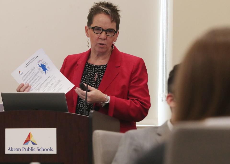 Ellen McWilliams-Woods, assistant superintendent and chief of academics, talks about the planning framework for the district's stimulus dollars at the Akron school board meeting.