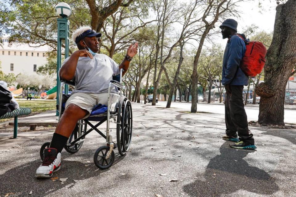 Armando Rivero, 64, waves at a passerby after the announcement of financial assistance being provided by the U.S. Department of Housing and Urban Development to help people experiencing homelessness. The press conference was held at the Stephen Clark Center, where many of Miami’s homeless population live, on Thursday, Feb. 2, 2023.