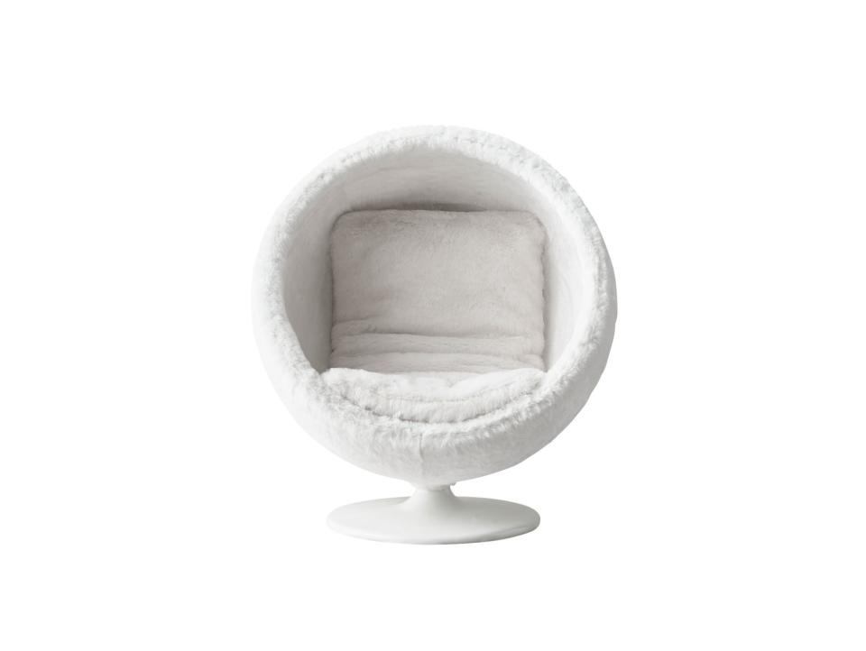 RH Baby & Child Orbit Kashmir faux-fur chair in white. 41.75" W. x 35.75" D. x 47.25" H.; $1,499. <a rel="nofollow noopener" href="https://www.rhbabyandchild.com/" target="_blank" data-ylk="slk:rhbabyandchild.com;elm:context_link;itc:0;sec:content-canvas" class="link ">rhbabyandchild.com</a>