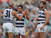 James Podsiadly, Steven Motlop and Tom Hawkins celebrate a goal by Podsiadly during the round nine AFL match between Port Adelaide Power and the Geelong Cats at AAMI Stadium on May 25, 2013 in Adelaide, Australia.