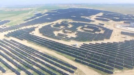 An aerial view shows panda-shaped solar plants built by Panda Green Energy Group in Datong, Shanxi province, China in this still image taken from a video footage, courtesy of Panda Green Energy Group, shot July 21, 2017. Panda Green Energy Group/Handout via REUTERS