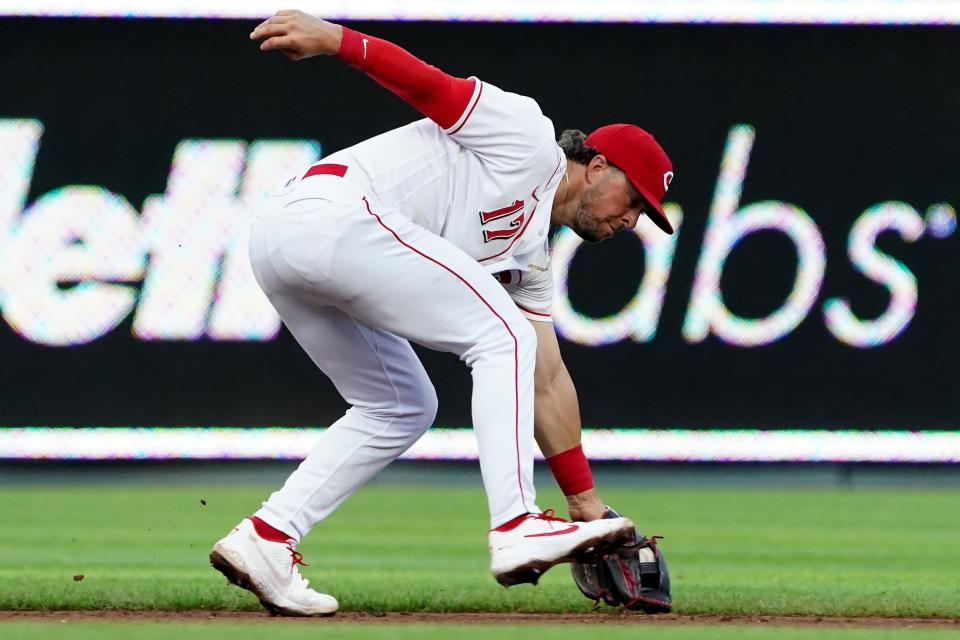 Cincinnati Reds shortstop Kyle Farmer (17) fields a groundball during the fifth inning of a baseball game against the Miami Marlins, Wednesday, July 27, 2022, at Great American Ball Park in Cincinnati. 