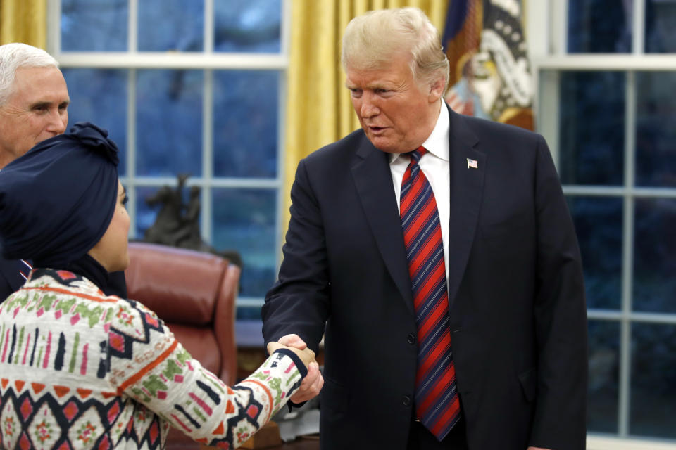 President Donald Trump greets people during a naturalization ceremony in the Oval Office of the White House, in Washington, Saturday, Jan. 19, 2019. (AP Photo/Alex Brandon)