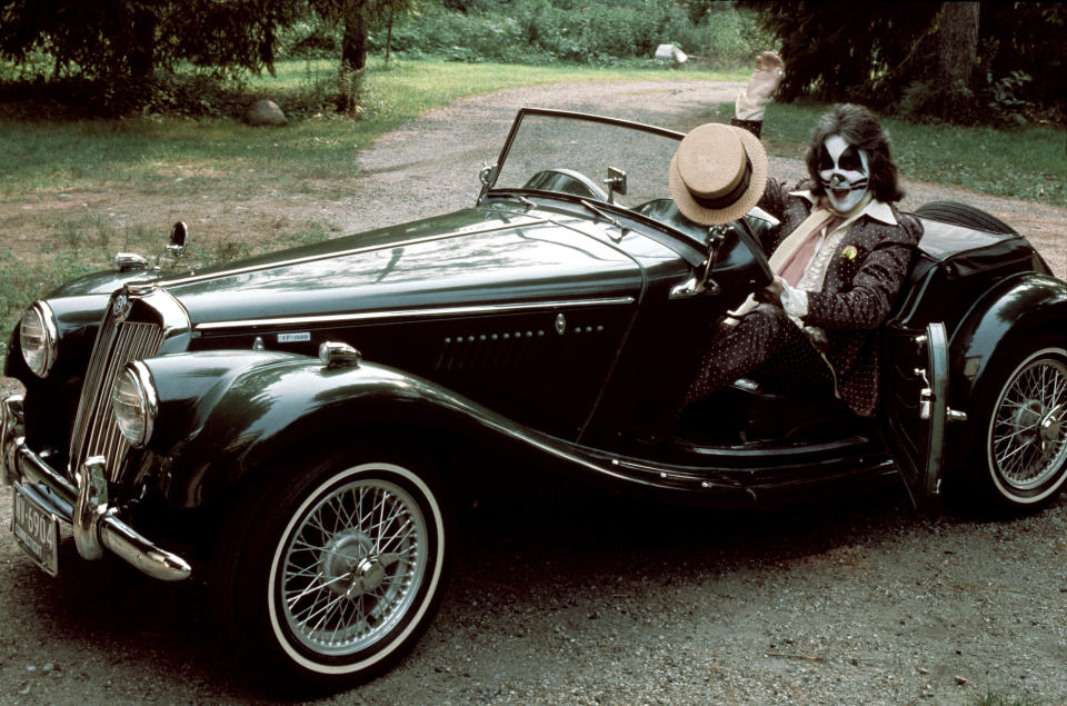 Peter Criss poses in a vintage sports car. (Photo by Fin Costello/Redferns)