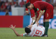 <p>In the thick of it: Diego Costa lies on the ground as Portugal’s Pepe goes to his aid. (AP) </p>