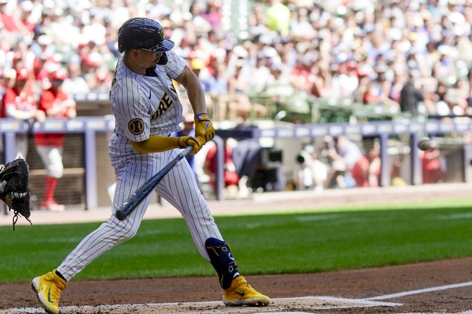 Milwaukee Brewers' Willy Adames hits a single during the first inning of a baseball game against the Philadelphia Phillies Sunday, Sept. 3, 2023, in Milwaukee. (AP Photo/Morry Gash)