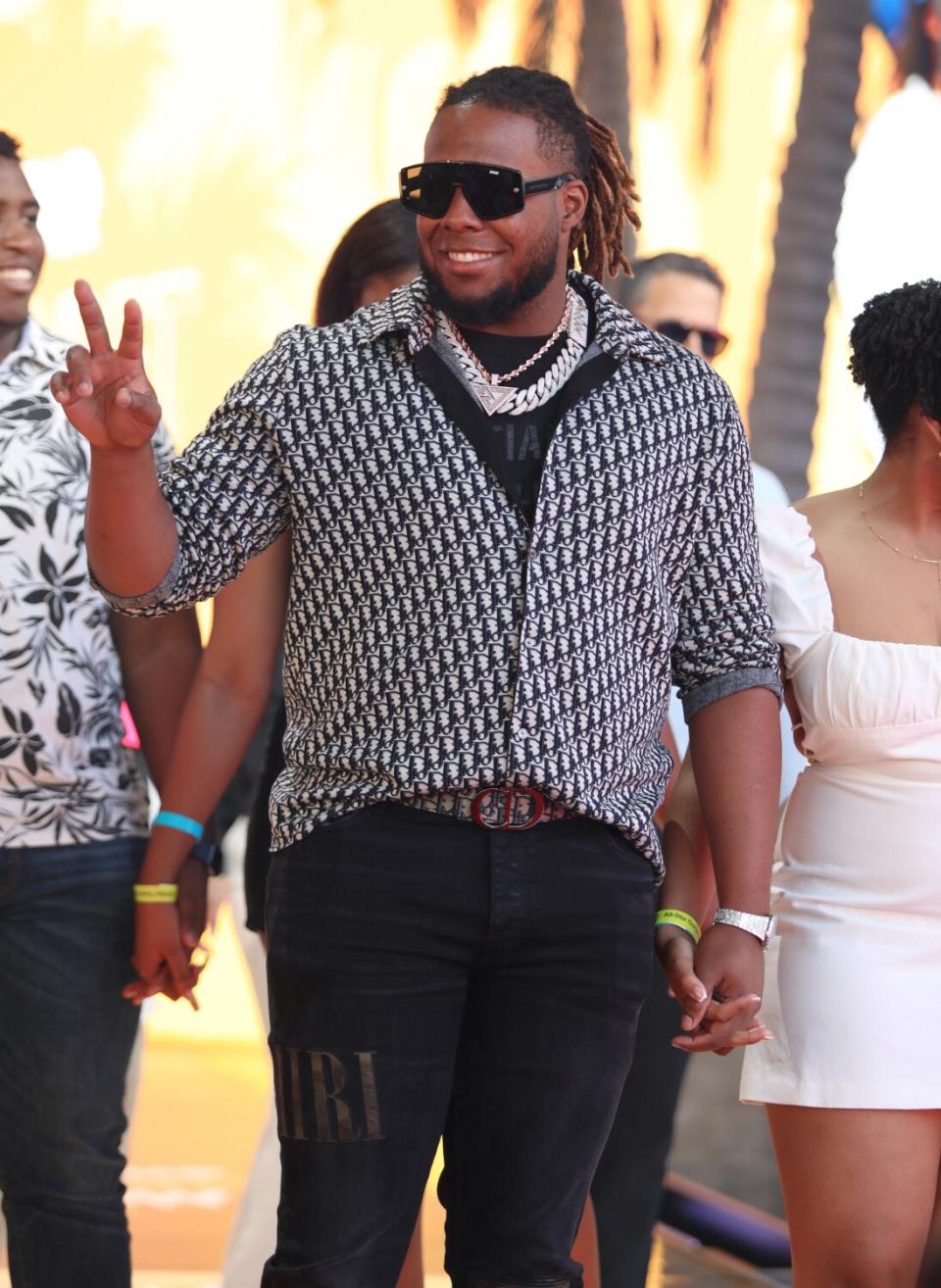 Vladimir Guerrero Jr. in a patterned shirt and family arrive at the 2022 MLB All-Star Game Red Carpet Show.