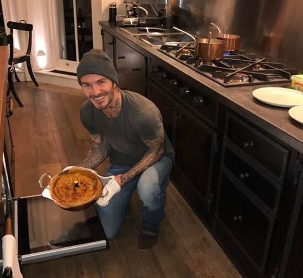 David seen holding a pie, sowing off the very expensive stove and copper pots and pans. Source: Instagram