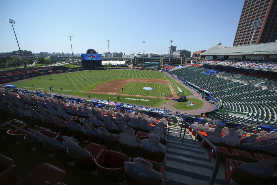 Fan cutouts fill seats of the upper level of Sahlen Field as the Toronto Blue Jays and Houston Astros warm up before a baseball game in Buffalo, N.Y., Sunday, June 6, 2021. (AP Photo/Joshua Bessex)