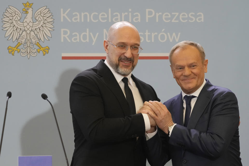 Ukrainian Prime Minister Denys Shmyhal, left, and Poland's Prime Minister Donald Tusk greet each other after making statements to the media following talks in Warsaw, Poland, Thursday, March 28, 2024. The prime ministers of Ukraine and Poland said they made progress Thursday toward meeting demands of Polish and western European farmers who want restrictions on cheap Ukrainian food imports that they say undermine their livelihoods, but they announced no breakthrough. (AP Photo/Czarek Sokolowski)