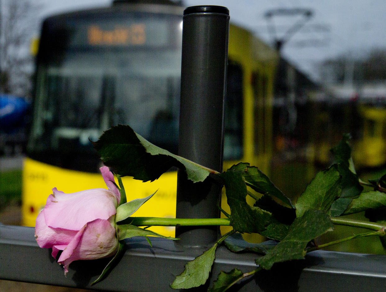 A tram passes a rose at the site of a shooting incident in a tram in Utrecht, Netherlands, March 19, 2019. (Photo: Peter Dejong/AP)