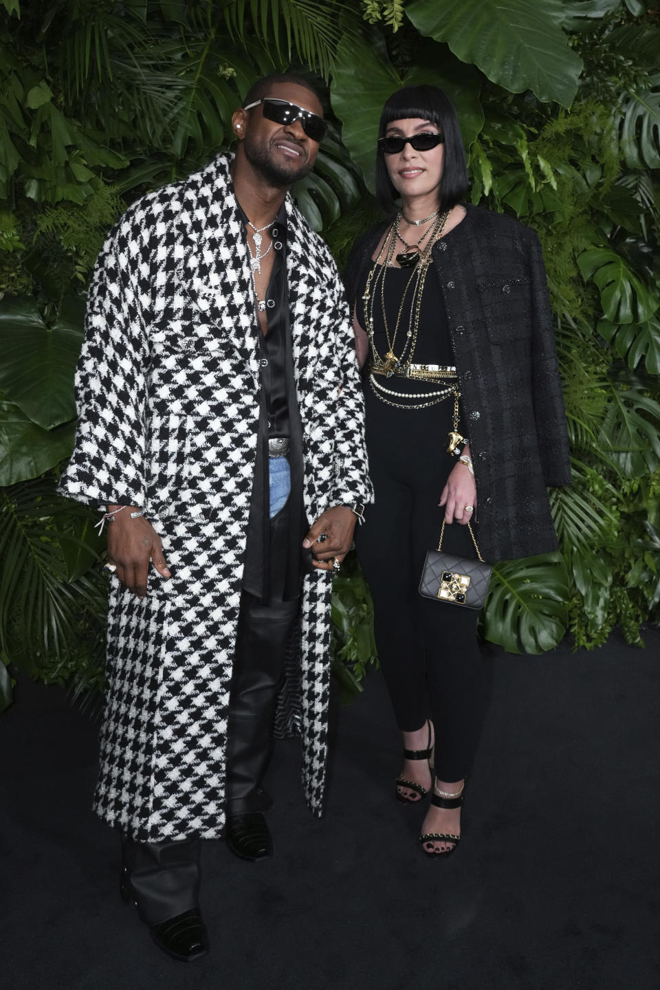 From left, Usher and Jennifer Goicoechea arrive at Chanel's 15th Annual Pre-Oscar Awards Dinner on Saturday, March 9, 2024, at the Beverly Hills Hotel in Los Angeles. (Photo by Jordan Strauss/Invision/AP)