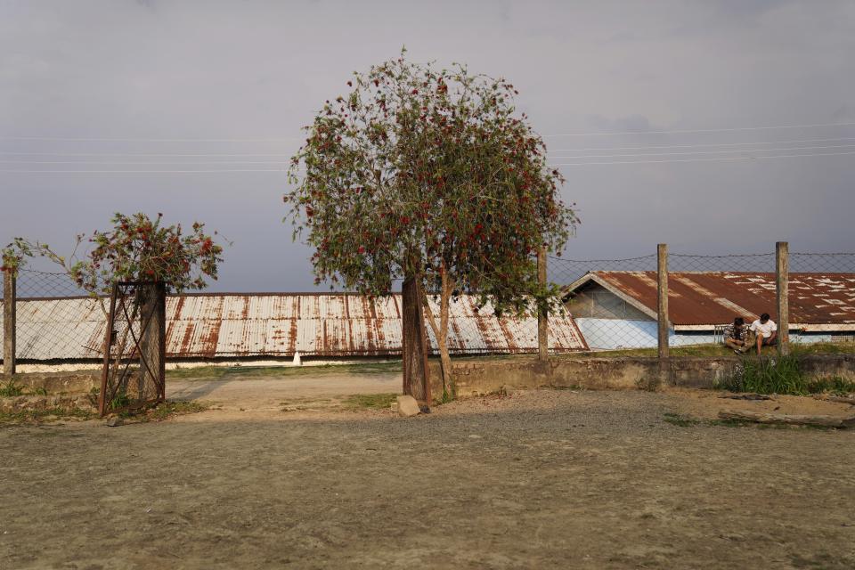 People rest outside a polling station on the eve of polling in Chedema village, in the northeastern Indian state of Nagaland, Thursday, April 18, 2024. (AP Photo/Yirmiyan Arthur)