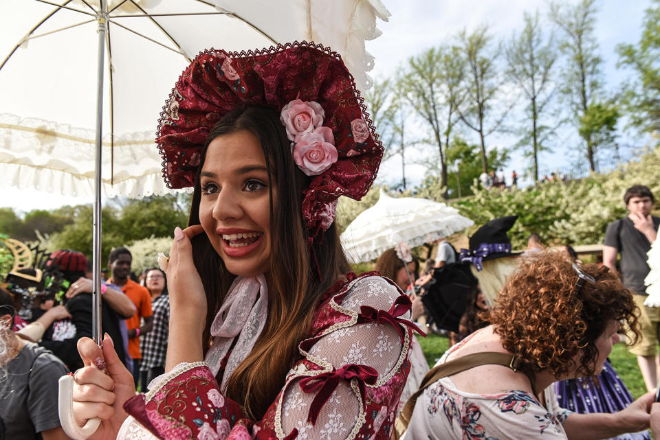 Woman holding parisol at Lolita-style fashion show