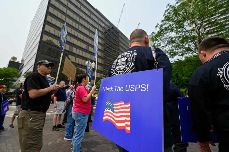 Current and retired postal workers joined together outside the U.S. Post Office in Boston during a rally, to try and prevent privatization of the post office, Tuesday, June 6, 2023.