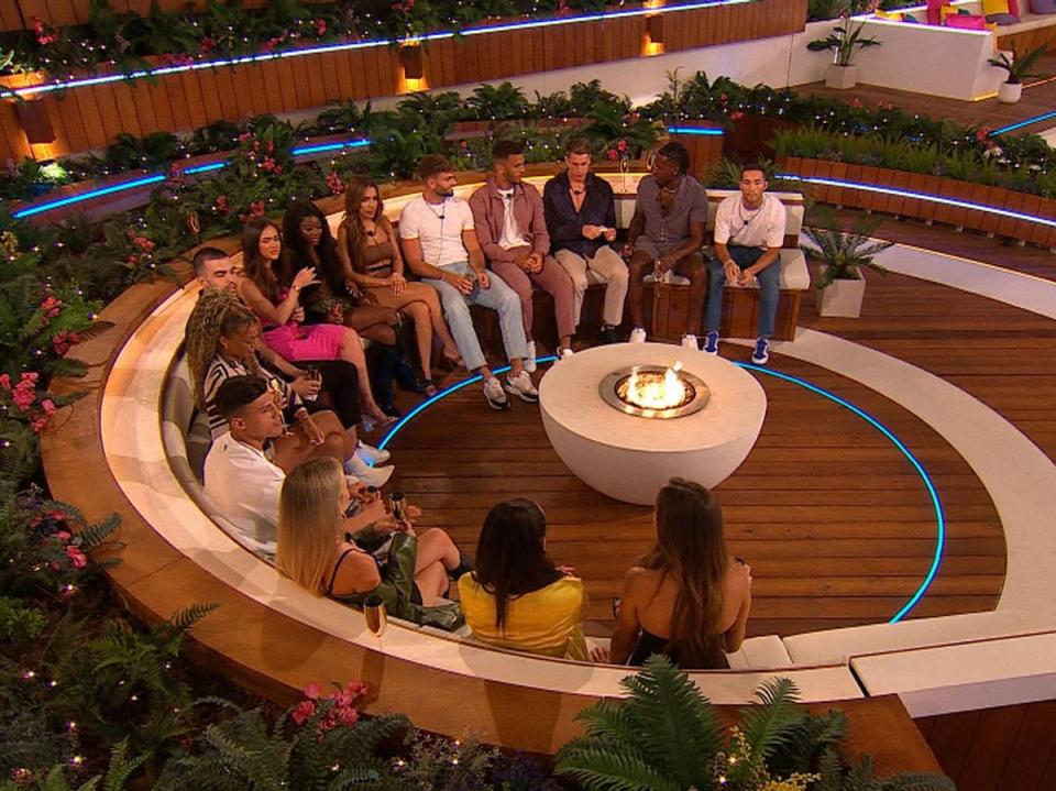 Love Island contestants around the firepit (ITV)