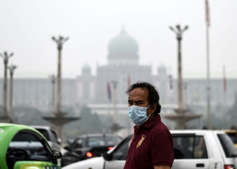 A man wears a face mask due to the haze in Putrajaya, Malaysia, on September 13, 2015