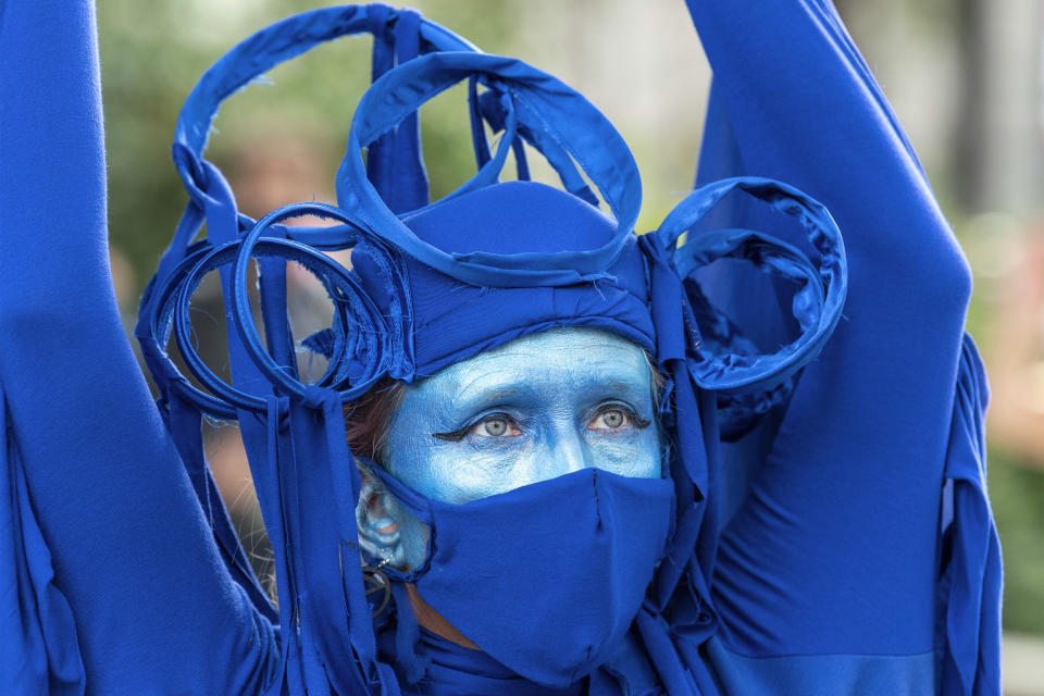  A protester wears a blue outfit to represent the ocean during the demonstration.
The groups of Extinction Rebellion Marine, Ocean Rebellion, Sea Life Extinction and Animal Rebellion marched in London in a �socially distanced grief march� to demand protection for the oceans and in protest against global governmental inaction to save the seas due to climate breakdown and human interference, and the loss of lives, homes and livelihoods from rising sea levels. (Photo by Dave Rushen / SOPA Images/Sipa USA) 