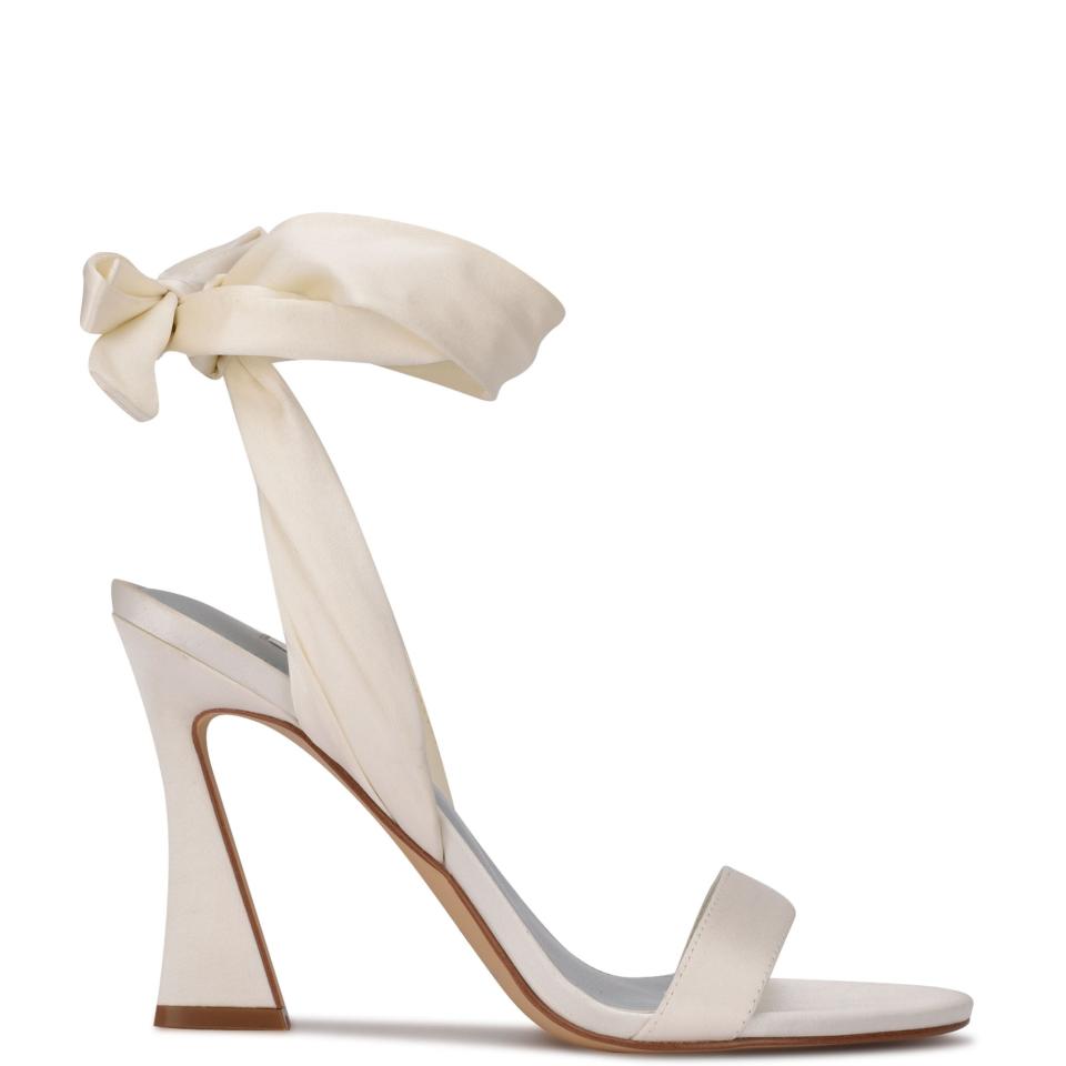 <p><a href="https://go.redirectingat.com?id=74968X1596630&url=https%3A%2F%2Fninewest.com%2Fproducts%2Fkelsie-ankle-wrap-heeled-sandals-in-white-satin&sref=https%3A%2F%2Fwww.womenshealthmag.com%2Flife%2Fg22519305%2Fbest-comfortable-wedding-shoes%2F" rel="nofollow noopener" target="_blank" data-ylk="slk:Shop Now;elm:context_link;itc:0;sec:content-canvas" class="link ">Shop Now</a></p><p>Kelsie Ankle Wrap Heeled Sandals</p><p>ninewest.com</p><p>$95.00</p>