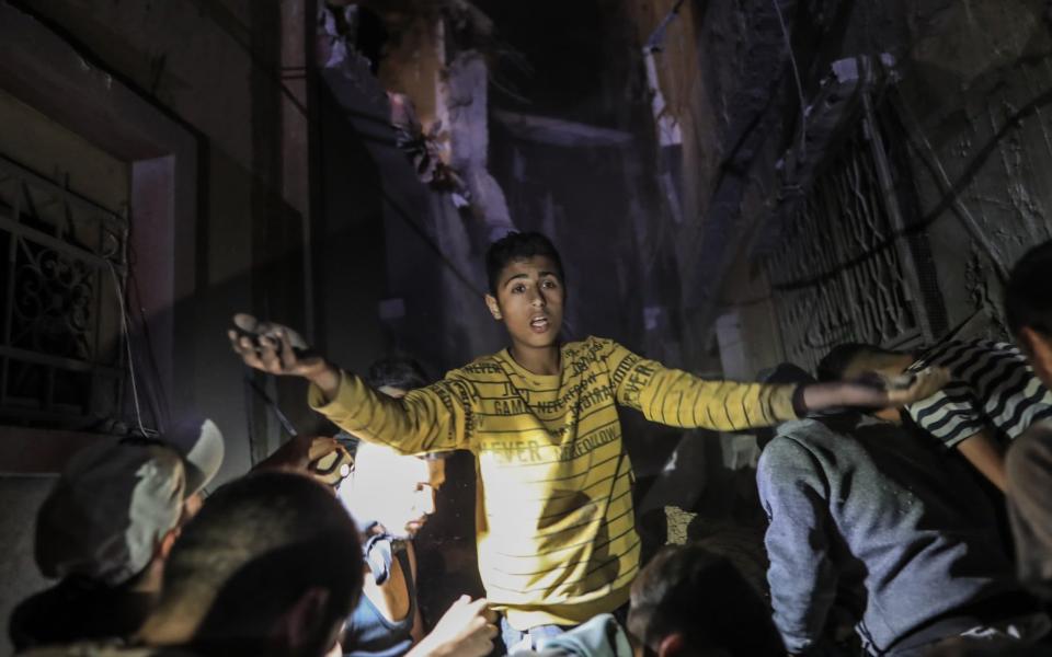 RAFAH, GAZA - APRIL 20: Locals carry out search and rescue efforts after an Israeli attack on Ridwan family house traps many Palestinians under rubble at Tel al-Sultan district of Rafah, Gaza on April 20, 2024