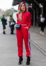 This woman showed up in a red tracksuit with heels and made it look like she had just walked out of a fashion catalogue.