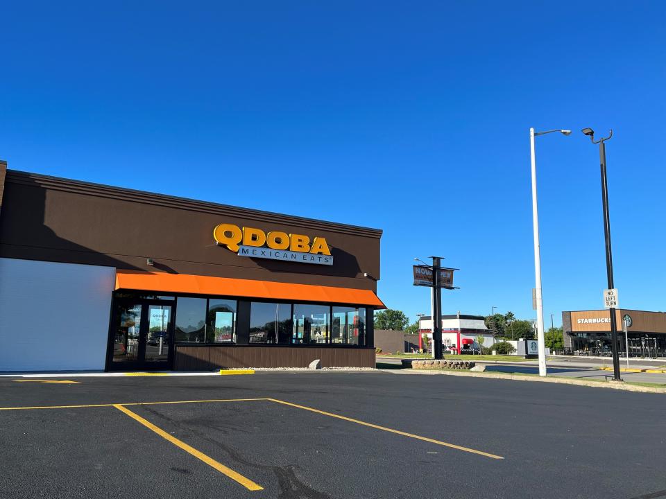 Qdoba stands near Starbucks along Eighth Street in Wisconsin Rapids.