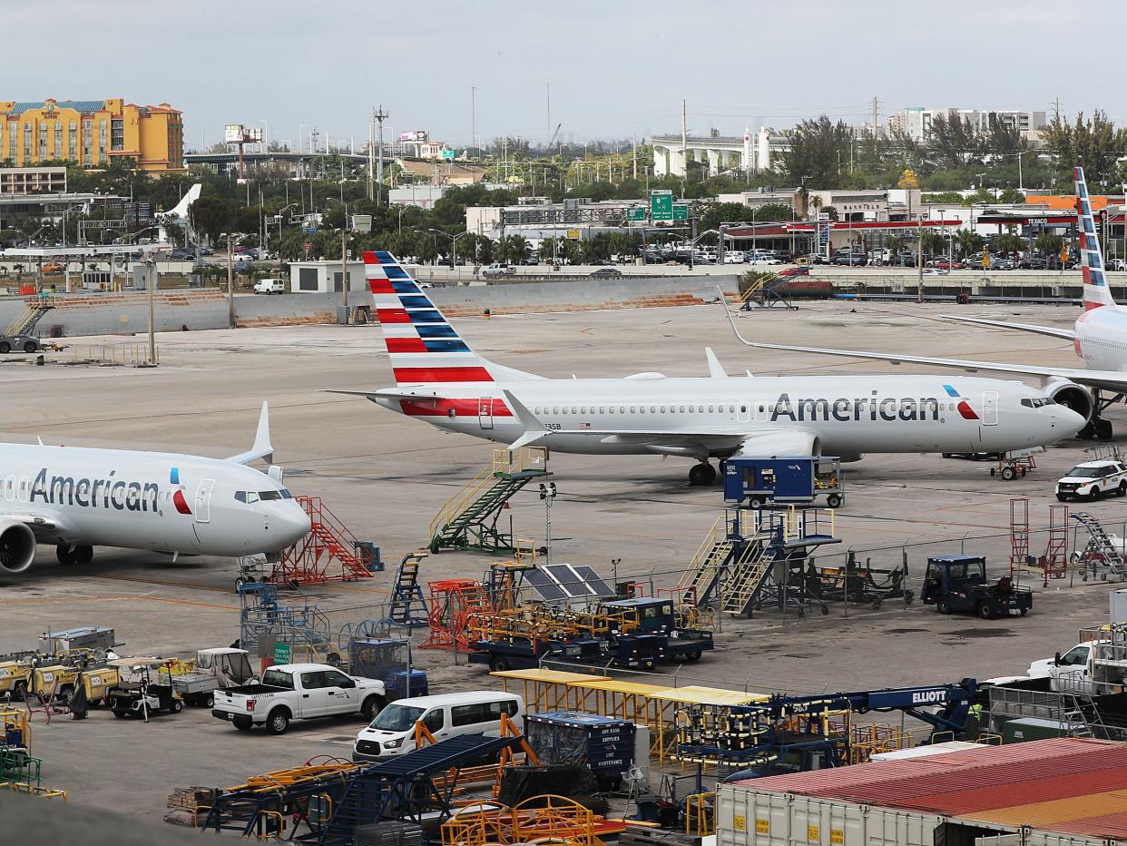 <p>Two grounded American Airlines Boeing 737 Max 8 are seen parked at Miami International Airport on 14 March 2019 in Miami, Florida</p> ((Getty Images))