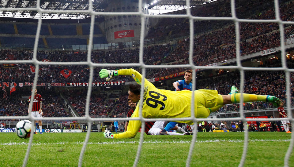 AC Milan’s Gianluigi Donnarumma denies Napoli’s Arkadiusz Milik with an incredible save. (Reuters)