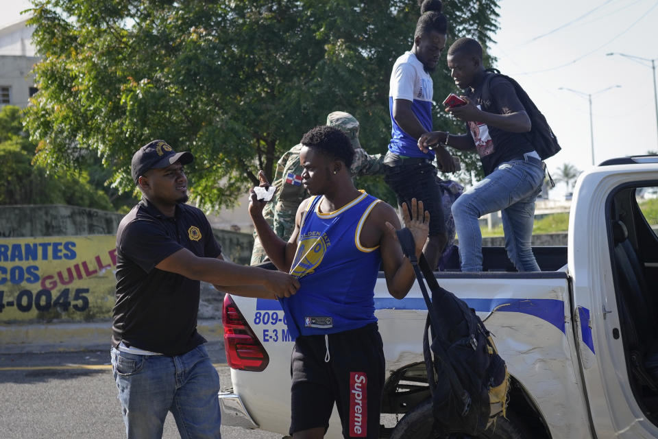 Migration officials detain undocumented Haitians in Santo Domingo, Dominican Republic, Thursday, May 16, 2024.As soaring violence and political turmoil grip neighboring Haiti, Dominican Republic’s election on May 19 has been defined by calls for more migratory crackdowns and finishing a border wall dividing the countries. (AP Photo/Matias Delacroix)