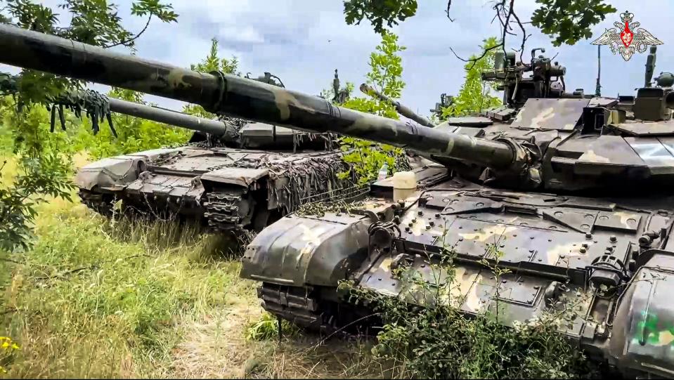 In this photo released by Russian Defense Ministry Press Service on Wednesday, July 12, 2023, Tanks belonging to Russia's Wagner military contractor are parked ahead of their handover to the Russian military at an undisclosed location. The Russian Defense Ministry said that Wagner Group is completing the handover of its weapons to the Russian military. The move follows Wagner's short-lived mutiny last month that challenged the Kremlin. (Russian Defense Ministry Press Service via AP)