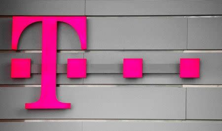FILE PHOTO: A logo of Germany's telecommunications giant Deutsche Telekom AG is seen before the company's annual news conference in Bonn, Germany, March 2, 2017. REUTERS/Wolfgang Rattay/File Photo
